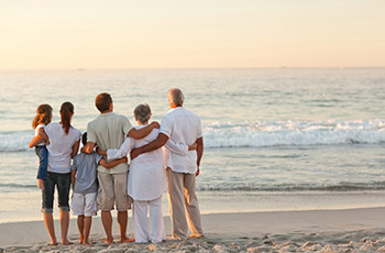 Family arm in arm  at Beach